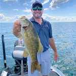 Angler with smallmouth bass img5291