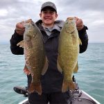 Boy with 2 smallmouth bass img5022