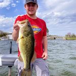 Boy with big largemouth bass img0341