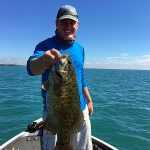 Man with big smallmouth bass img0518