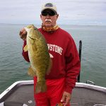 Man with big smallmouth bass img3875