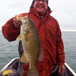 Man with smallmouth bass img0656