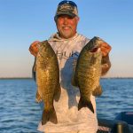 Man with two nice smallmouth img2336