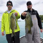 Two anglers with smallmouth bass img2500